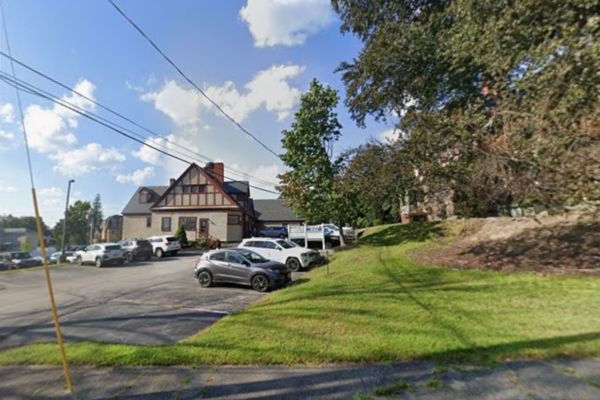 View of Carriage House parking lot from corner of Elm St and 33 W North St, Manchester
